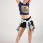 blonde-girl-posing-wearing-a-crop-top-tee-mockup-in-a-white-room-a19559