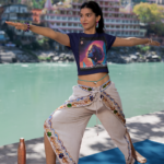 crop-top-mockup-featuring-a-woman-practicing-yoga-by-a-lake-m33670