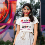 crop-top-mockup-featuring-a-woman-with-colorful-powders-on-her-face-for-the-holi-festival-m37210