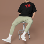 oversized-round-neck-tee-mockup-of-a-smiling-man-sitting-on-a-stool-in-a-studio-m38925
