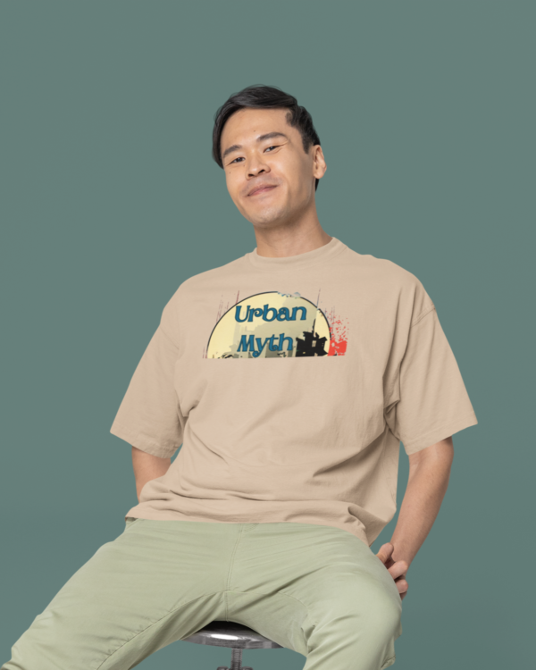 oversized-round-neck-tee-mockup-of-a-smiling-man-sitting-on-a-stool-in-a-studio-m38925_1_0ceeff96-b86f-4e7d-94c2-c3b853b33a95
