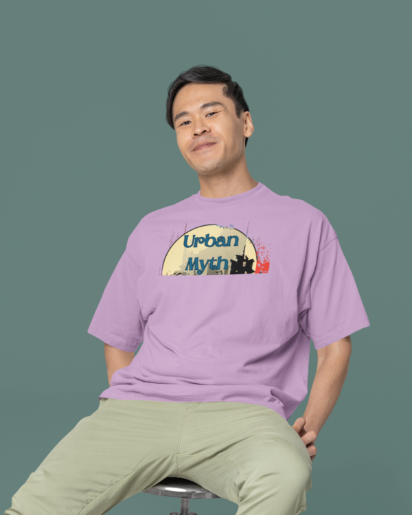 oversized-round-neck-tee-mockup-of-a-smiling-man-sitting-on-a-stool-in-a-studio-m38925_3_7d76e3ad-027e-4147-8be2-60a5a8cdb413