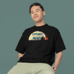 oversized-round-neck-tee-mockup-of-a-smiling-man-sitting-on-a-stool-in-a-studio-m38925_4_e6235e23-18e8-4f43-aba9-aaa2695cd6ab