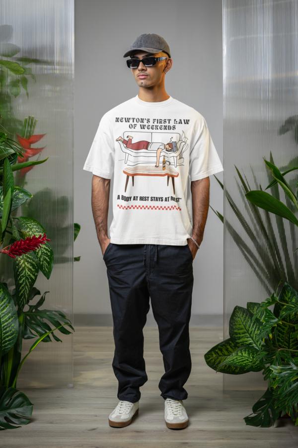 oversized-t-shirt-mockup-featuring-a-man-with-sunglasses-posing-with-plants-m54654
