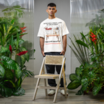 oversized-t-shirt-mockup-of-a-man-standing-in-a-secret-garden-inspired-setting-m54656