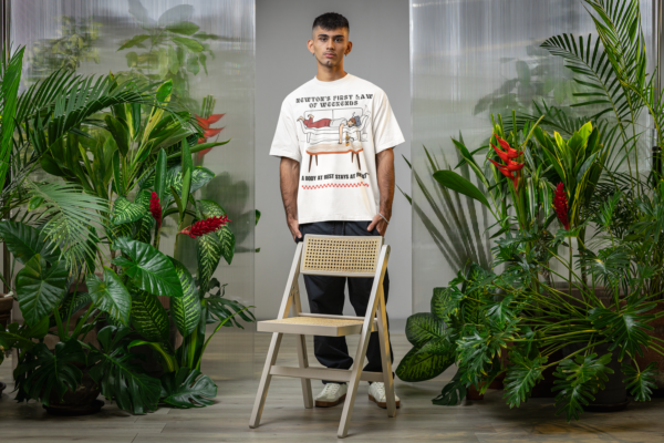oversized-t-shirt-mockup-of-a-man-standing-in-a-secret-garden-inspired-setting-m54656