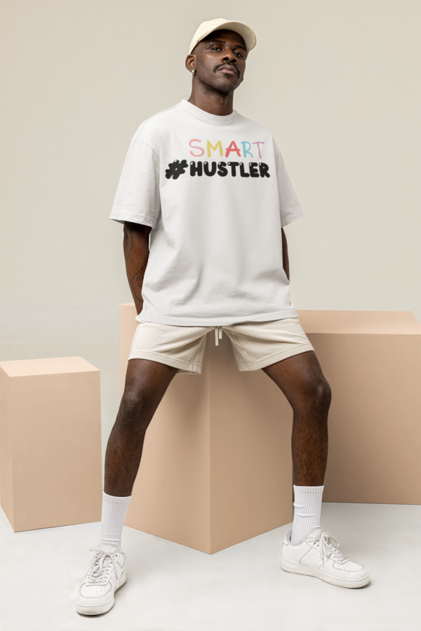 oversized-tee-mockup-featuring-a-man-sitting-on-an-ornamental-cube-m26161