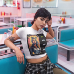 sleepy-girl-wearing-a-crop-top-tee-mockup-sitting-down-a19414