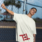 stanley-stella-t-shirt-mockup-featuring-a-serious-man-posing-against-a-wire-fence-m36830