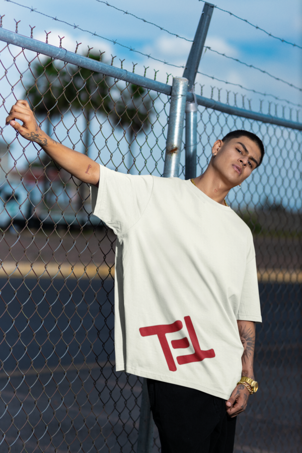 stanley-stella-t-shirt-mockup-featuring-a-serious-man-posing-against-a-wire-fence-m36830