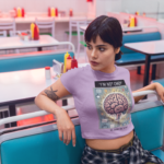 woman-wearing-a-crop-top-tee-mockup-in-a-diner-restaurant-a19412